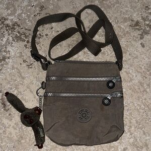 Kipling Brown Messenger Bag with Plush Charm